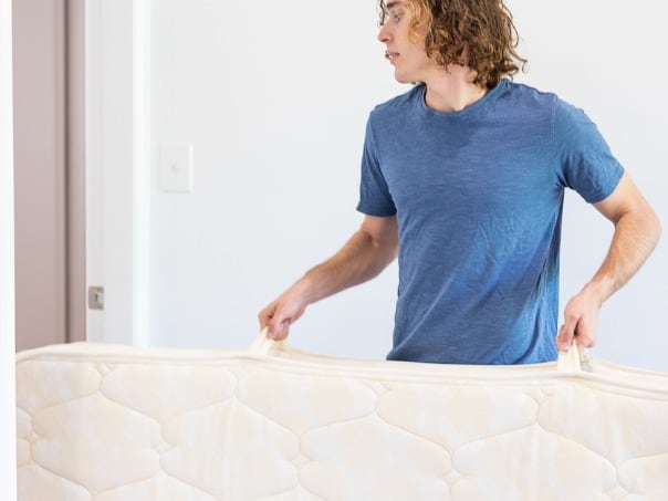 https://www.nectarsleep.com/wp-content/uploads/2022/02/young-man-moving-a-mattress-into-a-new-home-picture-id1306396728.jpg